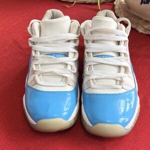 Jordan 11 Retro Low in the University Blue (or UNC) colorway. Size 7 boys great